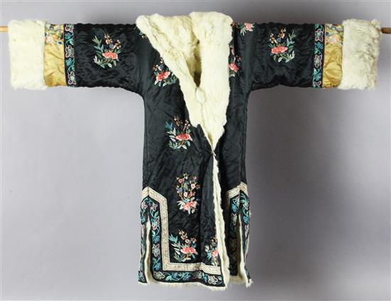 A Chinese black silk and fur winter coat, late Qing dynasty,